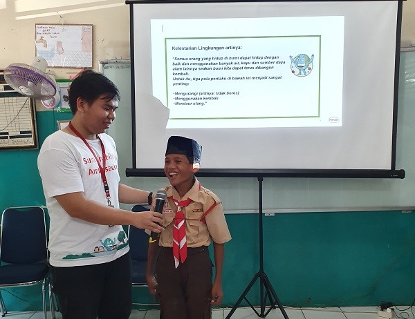 A student answering questions on sustainability.