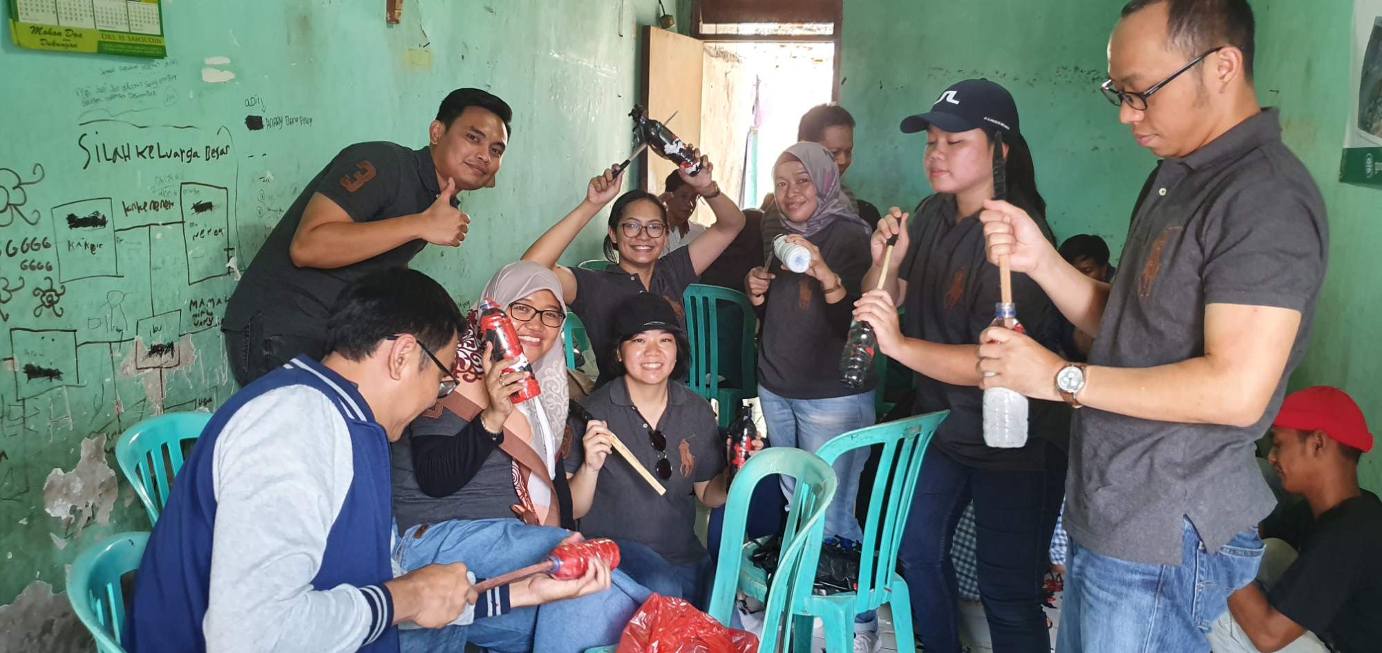 Our employees creating ecobricks by filling plastic bottles with plastic waste.