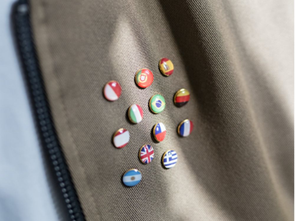 Badges with flags from all over the world attached to a jacket