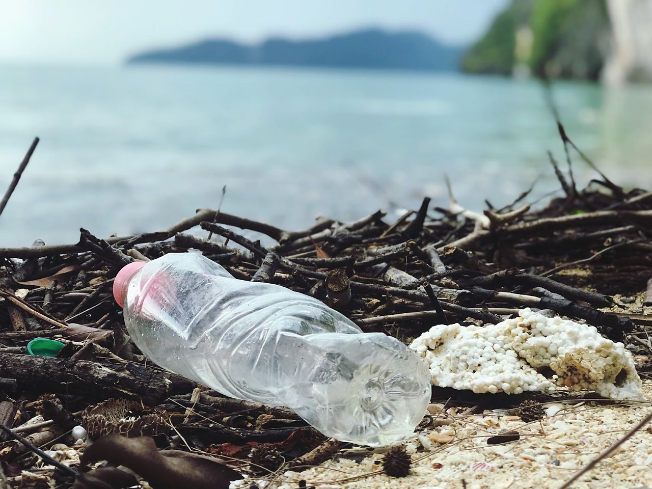 Discarded plastic bottle on the beach