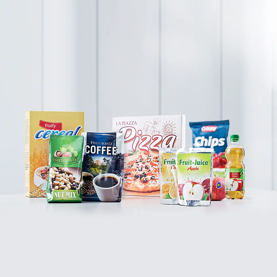 Food boxes and beverage packets lined up on display.