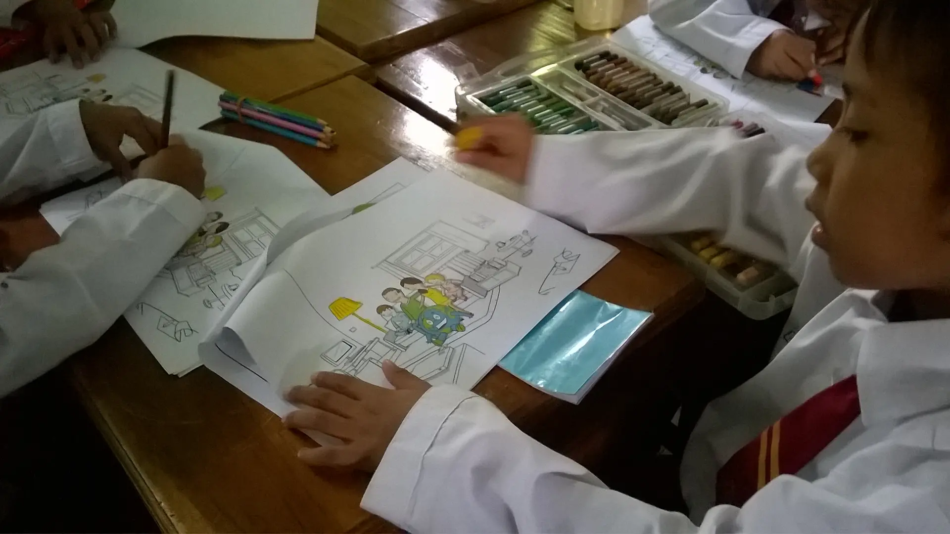 Children do some coloring activities as part of the program, to reinforce what they learn about sustainability.