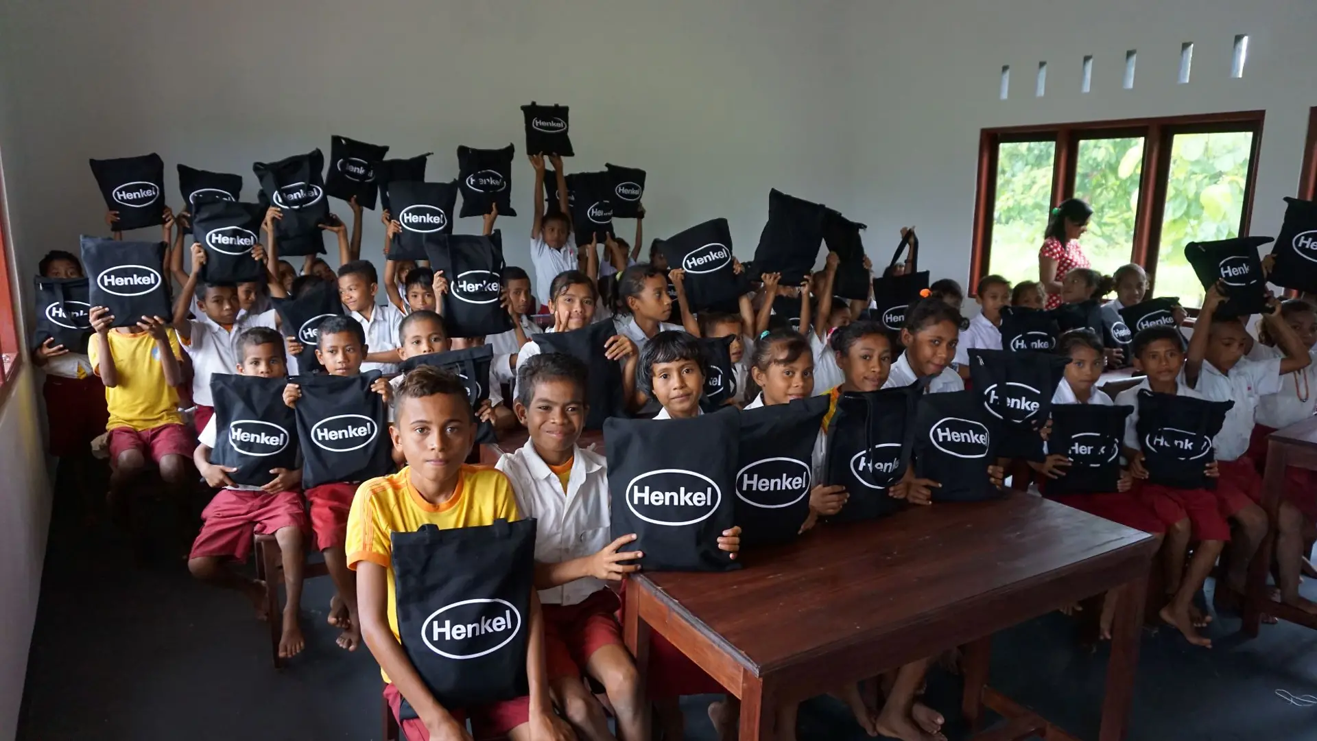 Students at the newly rebuilt SDN Amsila.